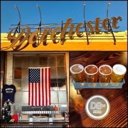 Seen from top: Dorchester Brewing Co. sign, U.S. flag, flight tray of four large glasses of beer