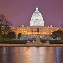 The US capitol building, with lighted dome, in background. In foreground, the Capitol Reflecting Pool and Ulysses S. Grant Memorial statue. Photo credit: "Glowing Washington DC Capitol" by Bold Frontiers is licensed under CC BY 2.0.