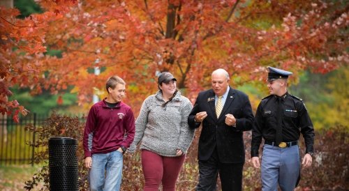 Alumnus with Students on NU Campus