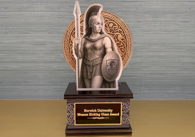 mockup image of an award with goddess athena holding a spear and shield, with words on the award: Norwich University Women Kicking Glass Award.